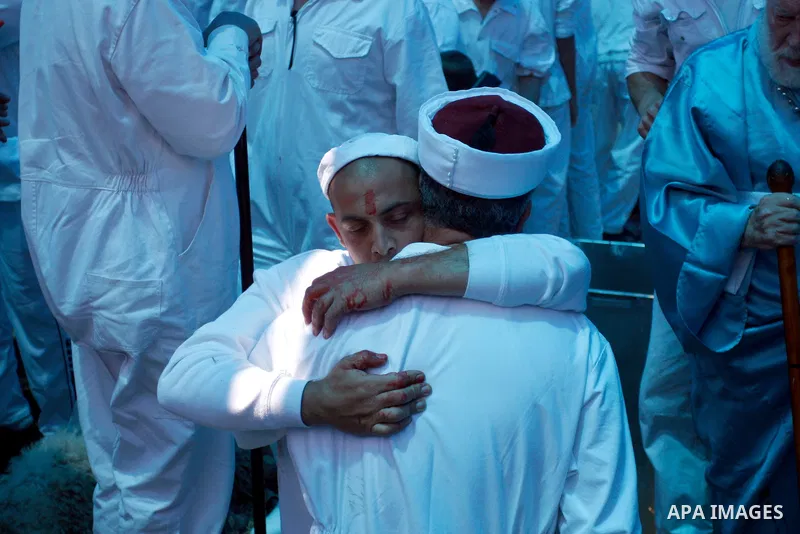 Samaritan priests and members of the ancient Samaritan community prepare the oven during the traditional Passover sacrifice ritual in Mount Gerizim, in the northern West Bank city of Nablus, 04 May 2012. According to tra...