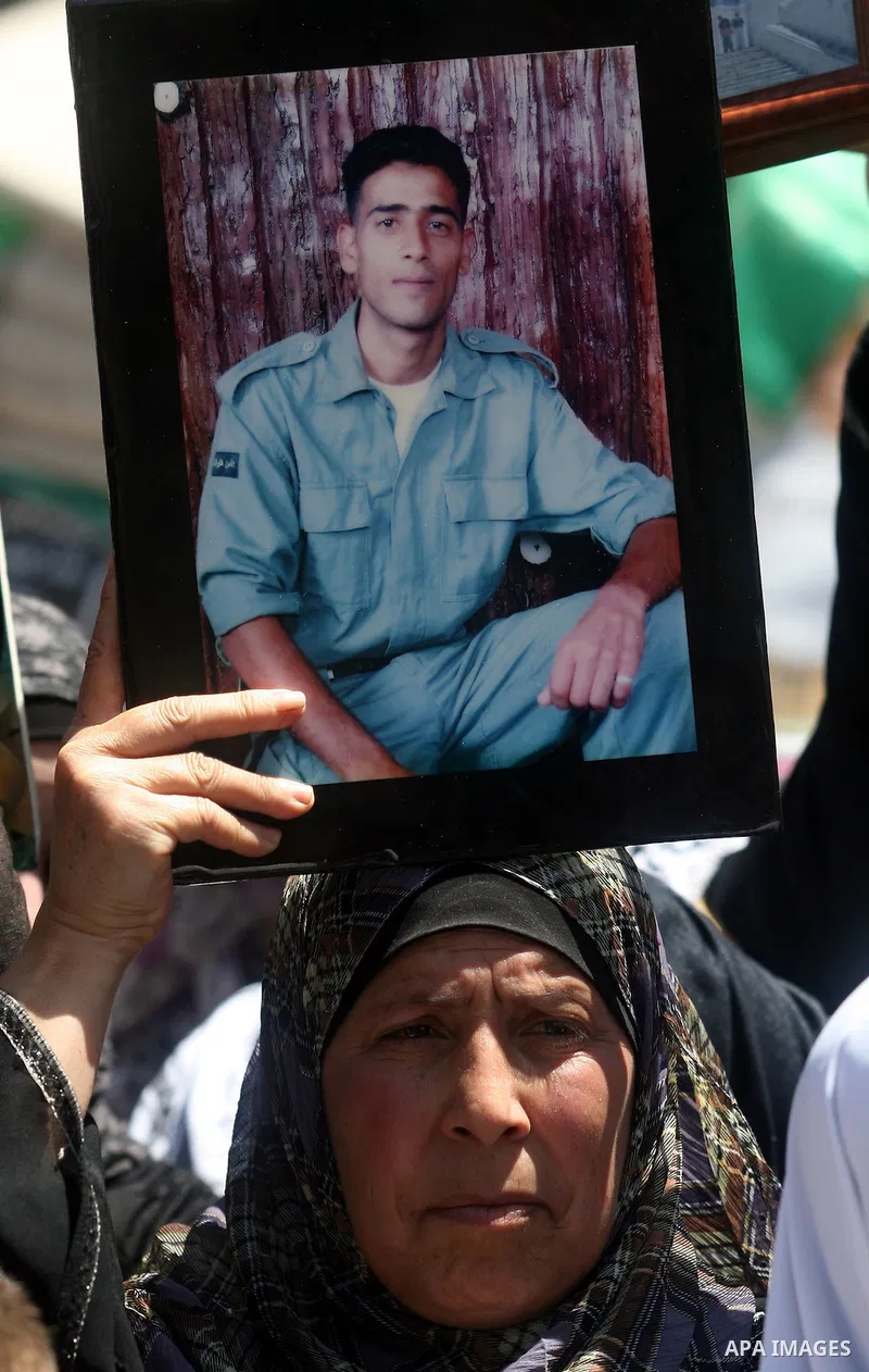 Supporters of the Islamic Hamas movement hold a rally in the West Bank city of Ramallah, calling for the release of prisoners being held in Israeli prisons on May 5, 2012, as ten Palestinian hunger strikers held at an Is...