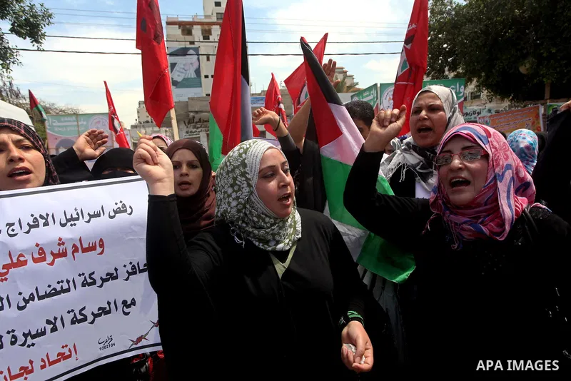 Relatives of hunger striking Palestinian inmates of Israeli prisons hold portraits during a sit-in solidarity protest in a tent, in Gaza City, Gaza Strip, on 04 May 2012. Protests continued in solidarity with hundreds of...