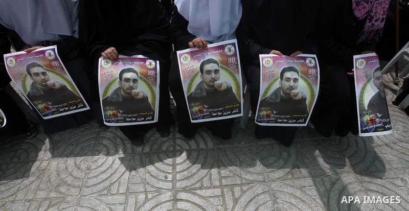 Relatives of hunger striking Palestinian inmates of Israeli prisons hold portraits during a sit-in solidarity protest in a tent, in Gaza City, Gaza Strip, on 04 May 2012. Protests continued in solidarity with hundreds of...