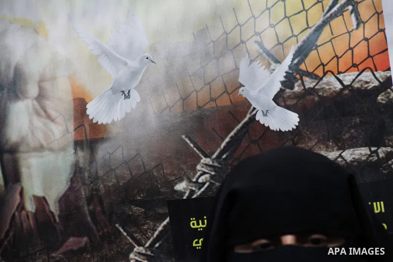 Relatives of hunger striking Palestinian inmates of Israeli prisons hold portraits during a sit-in solidarity protest in a tent, in Gaza City, Gaza Strip, on 04 May 2012. Protests continued in solidarity with hundreds of...