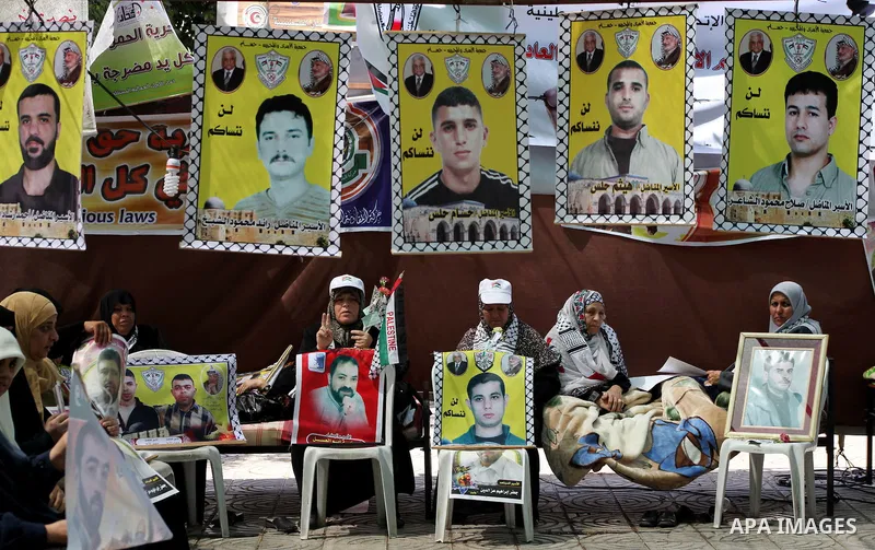 Relatives of hunger striking Palestinian inmates of Israeli prisons hold portraits during a sit-in solidarity protest in a tent, in Gaza City, Gaza Strip, on 04 May 2012. Protests continued in solidarity with hundreds of...