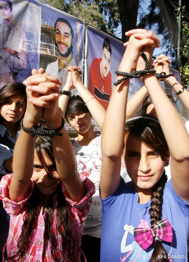 Palestinian protesters rally in east Jerusalem on May 6, 2012 to demand the release of Palestinian prisoners in Israeli prisons, many of whom are currently on hunger strike. At least 1,550 Palestinian prisoners are now o...