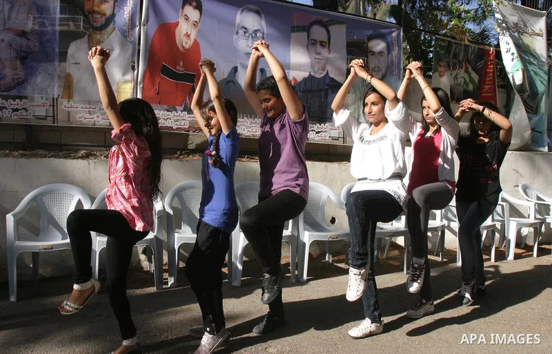 Palestinian protesters rally in east Jerusalem on May 6, 2012 to demand the release of Palestinian prisoners in Israeli prisons, many of whom are currently on hunger strike. At least 1,550 Palestinian prisoners are now o...