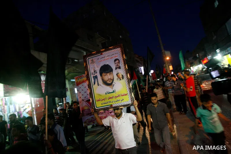 Supporters of Palestinian Democratic Front participate in a rally supporting Palestinian inmates on hunger strike since mid-April 2012, in Gaza City, May 6, 2012. A Palestinian rights group said recently that half of abo...