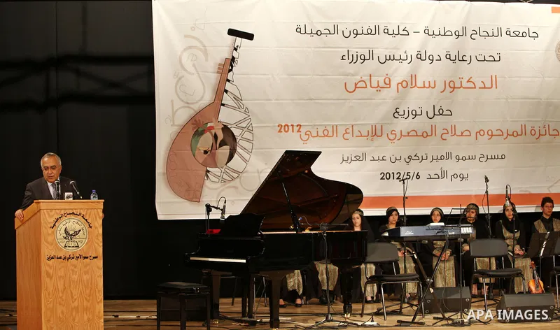 Palestinian Prime Minister, Salam Fayyad, honors students of the winners of the award late Salah Al Masri "artistic creativity", in the West Bank town of Nablus, May 6, 2012. Photo by Mustafa Abu Dayeh