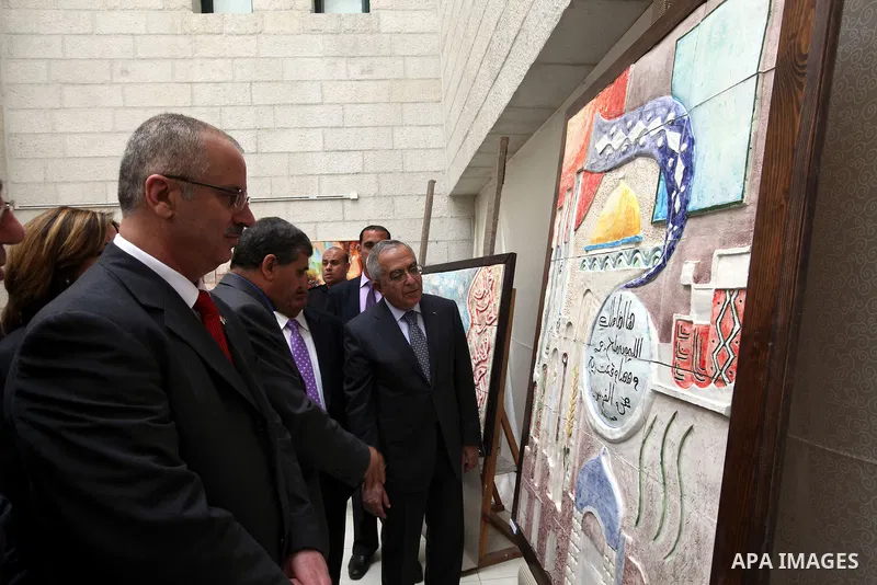 Palestinian Prime Minister, Salam Fayyad, attends opening of the exhibition of Fine Arts at An-Najah University National, in the West Bank town of Nablus, May 6, 2012. Photo by Mustafa Abu Dayeh