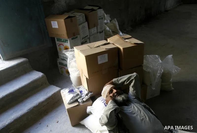 A Palestinian man receives monthly food aid from the United Nations Relief and Works Agency (UNRWA) center in the Rafah refugee camp, southern Gaza on May 07, 2012. The UN Agency for Palestinian Refugees (UNRWA) in Gaza...