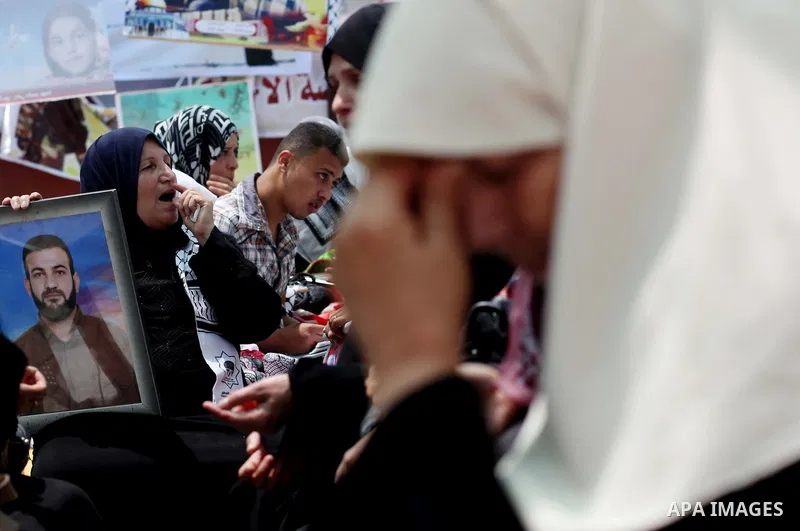 Palestinian women attend a rally in Gaza City, to show solidarity with Palestinian prisoners held in Israeli jails on May 7, 2012. At least 1,550 Palestinian prisoners are refusing food in Israeli jails in a protest agai...