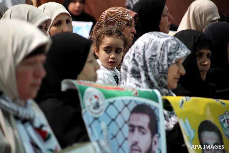 Palestinian women attend a rally in Gaza City, to show solidarity with Palestinian prisoners held in Israeli jails on May 7, 2012. At least 1,550 Palestinian prisoners are refusing food in Israeli jails in a protest agai...