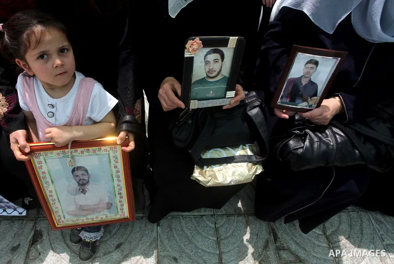 Palestinian women attend a rally in Gaza City, to show solidarity with Palestinian prisoners held in Israeli jails on May 7, 2012. At least 1,550 Palestinian prisoners are refusing food in Israeli jails in a protest agai...
