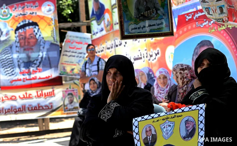 Palestinian women attend a rally in Gaza City, to show solidarity with Palestinian prisoners held in Israeli jails on May 7, 2012. At least 1,550 Palestinian prisoners are refusing food in Israeli jails in a protest agai...
