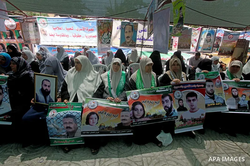 Palestinian women attend a rally in Gaza City, to show solidarity with Palestinian prisoners held in Israeli jails on May 7, 2012. At least 1,550 Palestinian prisoners are refusing food in Israeli jails in a protest agai...