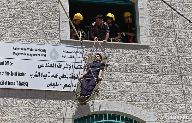 Palestinian Prime Minister, Salam Fayyad, (not seen) attends during a training session following the campaign "your Safety", in the West Bank City of Tubas, on May 07, 2012. Photo by Mustafa Abu Dayeh