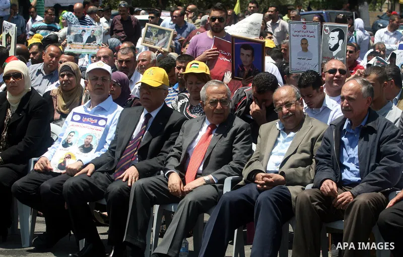 Palestinian Prime Minister Salam Fayyad,participates in a rally supporting Palestinian inmates on hunger strike since mid-April 2012, in the West Bank City of Ramallah, May 8, 2012. A Palestinian rights group said recent...