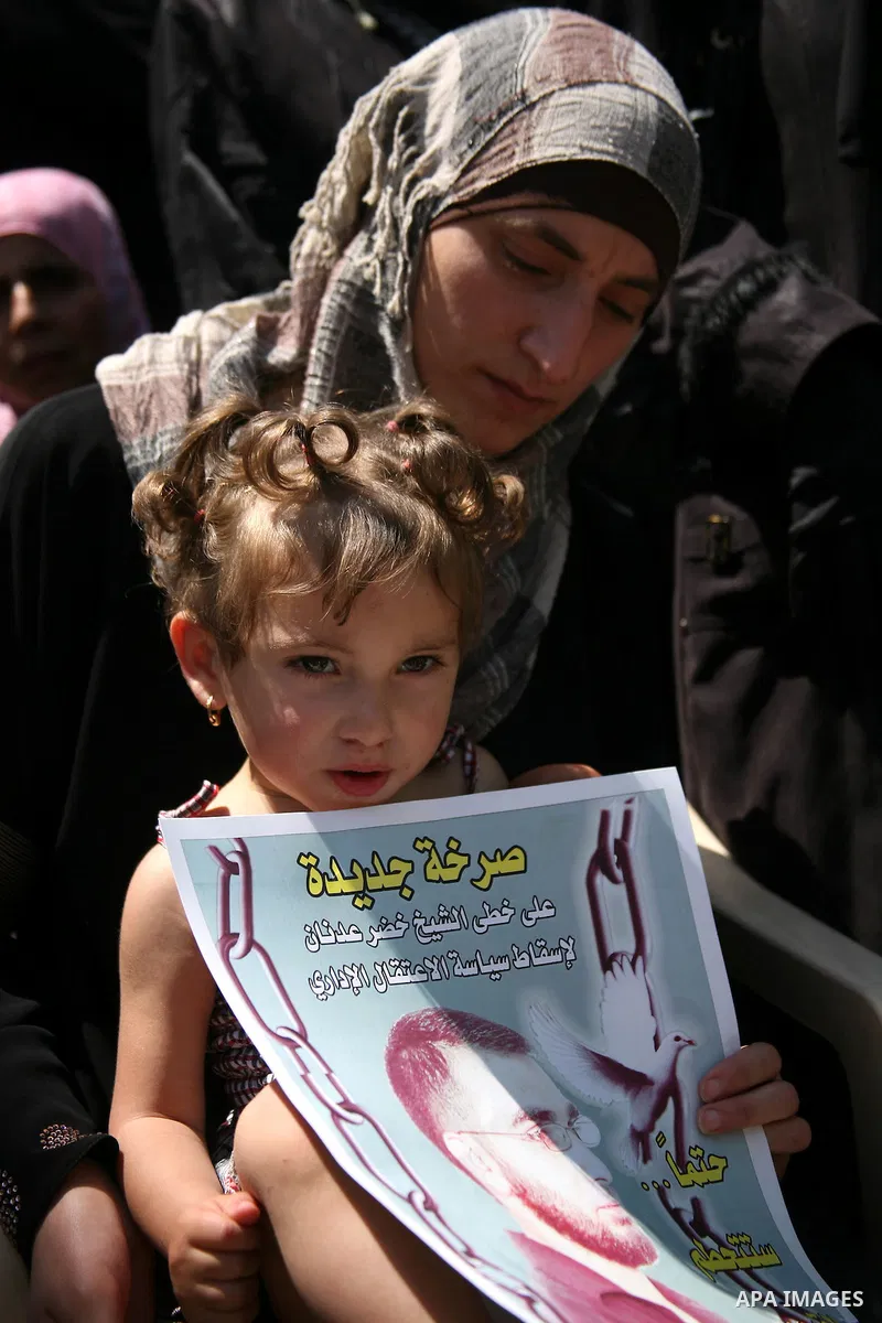 Palestinians hold a sit-in in front of the house of prisoner Thaer Halahle in the West Bank village of Kharas near Hebron, on May 8, 2012. Two Palestinian prisoners Thaer Halahleh, 33, and Bilal Diab, 27, who are on thei...