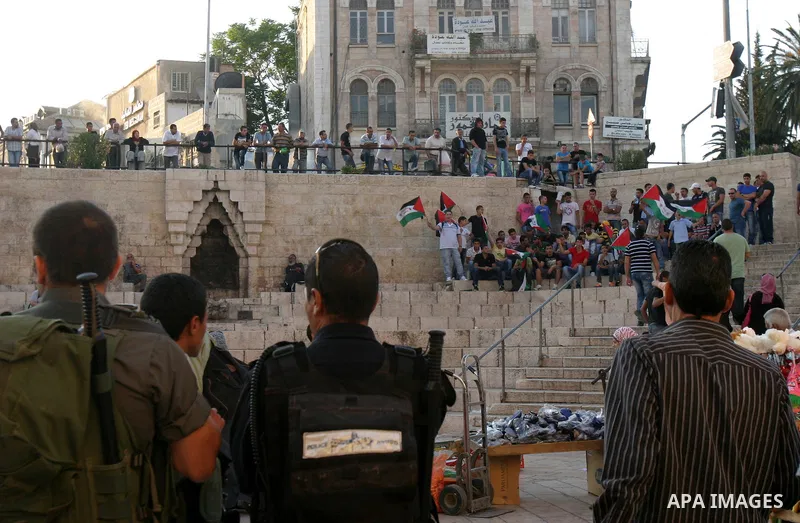Palestinians carry Palestinian flags during a rally calling for unity and change in east Jerusalem on May 8, 2012. Photo by Mahfouz Abu Turk
