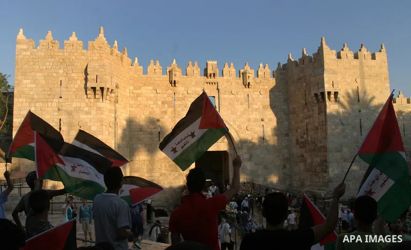 Palestinians carry Palestinian flags during a rally calling for unity and change in east Jerusalem on May 8, 2012. Photo by Mahfouz Abu Turk