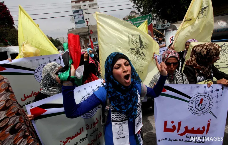 Palestinian women shout slogans aduring a demonstration in Gaza City on May 8, 2012 in solidarity with the prisoners. At least 1,550 imprisoned Palestinians are now taking part in a mass hunger strike. Photo by Ashraf Am...