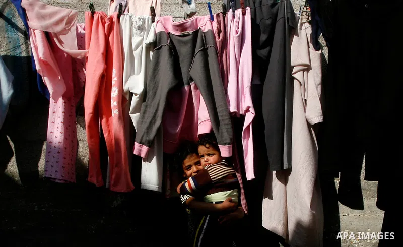 A Palestinian children play in front of their house in the Rafah refugee camp in the southern area of the Gaza Strip on May 09 2012. On May 15 Palestinians will mark "Nakba," or catastrophe, of Israel's founding in a 194...