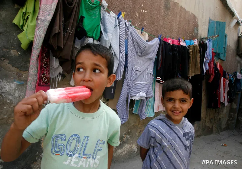 A Palestinian children play in front of their house in the Rafah refugee camp in the southern area of the Gaza Strip on May 09 2012. On May 15 Palestinians will mark "Nakba," or catastrophe, of Israel's founding in a 194...
