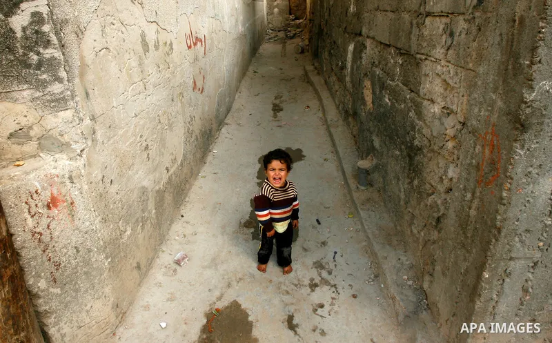 A Palestinian child plays in front of his house in the Rafah refugee camp in the southern area of the Gaza Strip on May 09 2012. On May 15 Palestinians will mark "Nakba," or catastrophe, of Israel's founding in a 1948 wa...