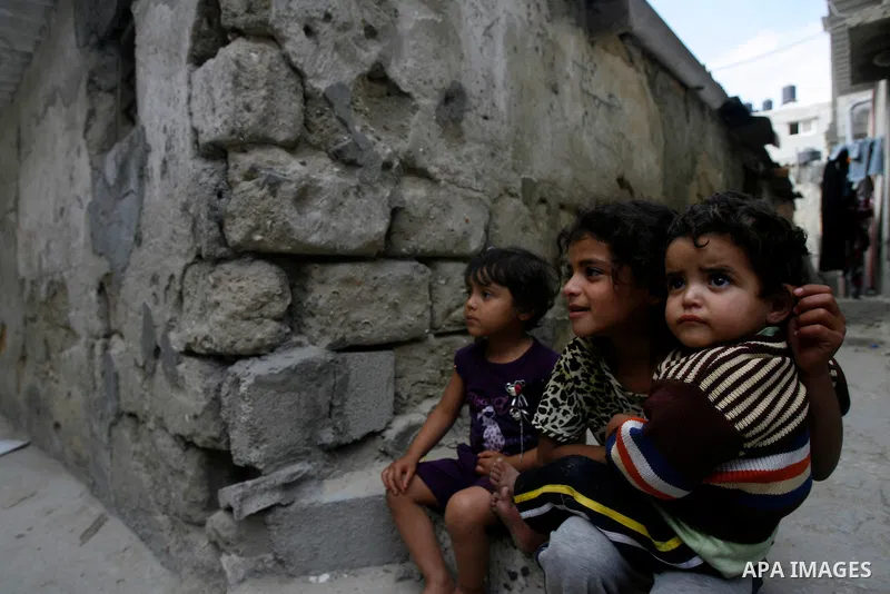 A Palestinian children play in front of their house in the Rafah refugee camp in the southern area of the Gaza Strip on May 09 2012. On May 15 Palestinians will mark "Nakba," or catastrophe, of Israel's founding in a 194...
