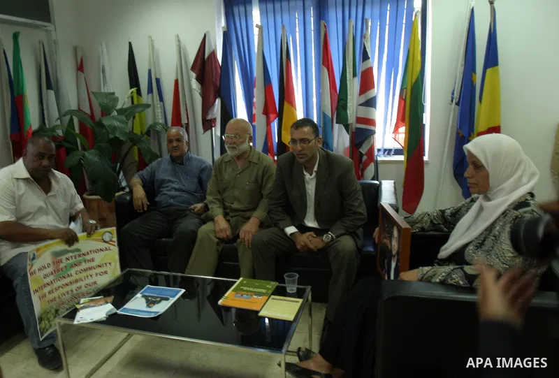 Palestinians deliver a message to the European Union Ambassador in Jerusalem during a protest in solidarity with prisoners on hunger strike, outside the European Union Representative Office in East Jerusalem May 10, 2012...
