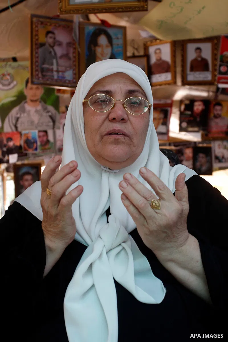 Palestinian woman performs Friday prayers during a sit-in, in the West Bank city of Nablus, May 11, 2012. palestinians held in prayer outside a tent, in solidarity with prisoners who have been waging a hunger strike in I...