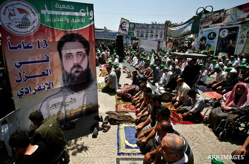 Palestinians attend Friday prayers in Gaza City in support of more than a thousand prisoners who are on an open-ended hunger strike in Israeli jails on May 11, 2012. At least 1,550 Palestinian prisoners are now on hunger...