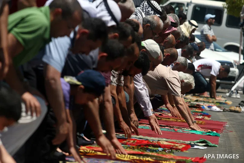 Palestinians perform Friday prayers during a sit-in, in the West Bank city of Ramallah, May 11, 2012. Palestinians held in prayer outside a tent, in solidarity with prisoners who have been waging a hunger strike in Israe...