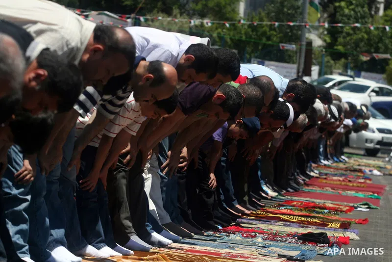 Palestinians perform Friday prayers during a sit-in, in the West Bank city of Ramallah, May 11, 2012. Palestinians held in prayer outside a tent, in solidarity with prisoners who have been waging a hunger strike in Israe...