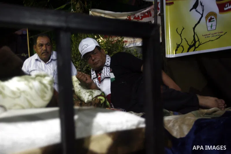 Palestinians attend a rally in Gaza City, to show solidarity with Palestinian prisoners held in Israeli jails on May 7, 2012. At least 1,550 Palestinian prisoners are refusing food in Israeli jails in a protest against t...