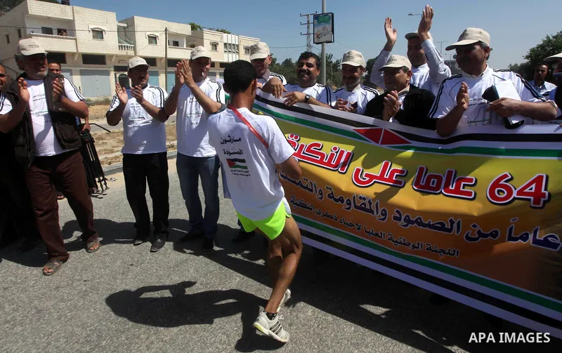 Palestinians Participant compete "Marathon of Return" near to the Erez crossing in the northern Gaza Strip on May 12, 2012. The Nakba commemorations mark the uprooting of Palestinians who fled or were driven out of their...