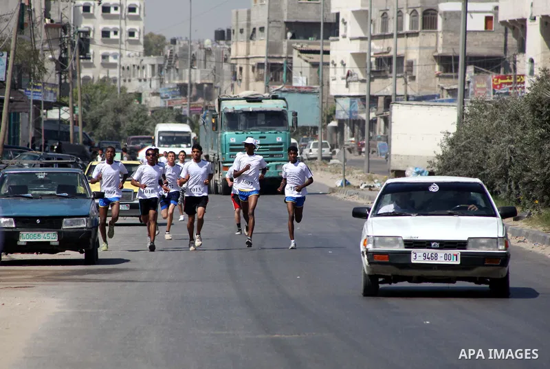 Palestinians Participant compete "Marathon of Return" near to the Erez crossing in the northern Gaza Strip on May 12, 2012. The Nakba commemorations mark the uprooting of Palestinians who fled or were driven out of their...