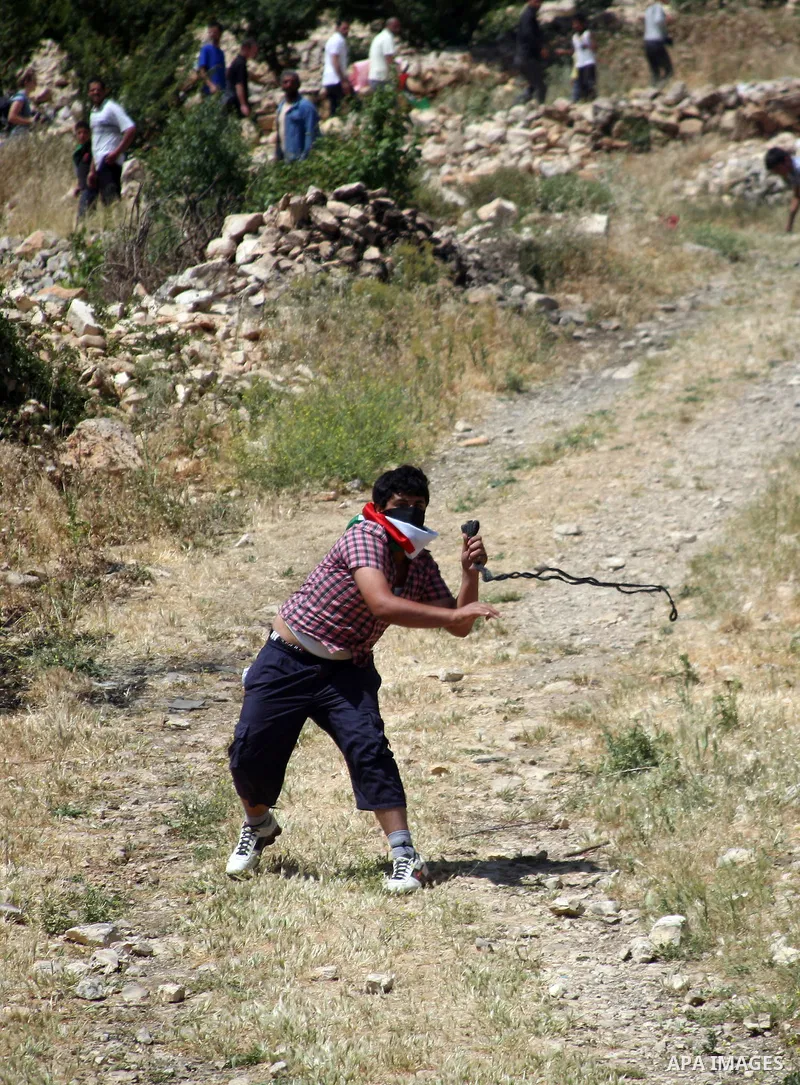 Palestinian stone throwers clash with Israeli soldiers during a demonstration ahead of "Nakba Day" in Beit Omar village, north of the West Bank town of Hebron, on May 12, 2012 where Israeli soldiers tried to evacuate dem...
