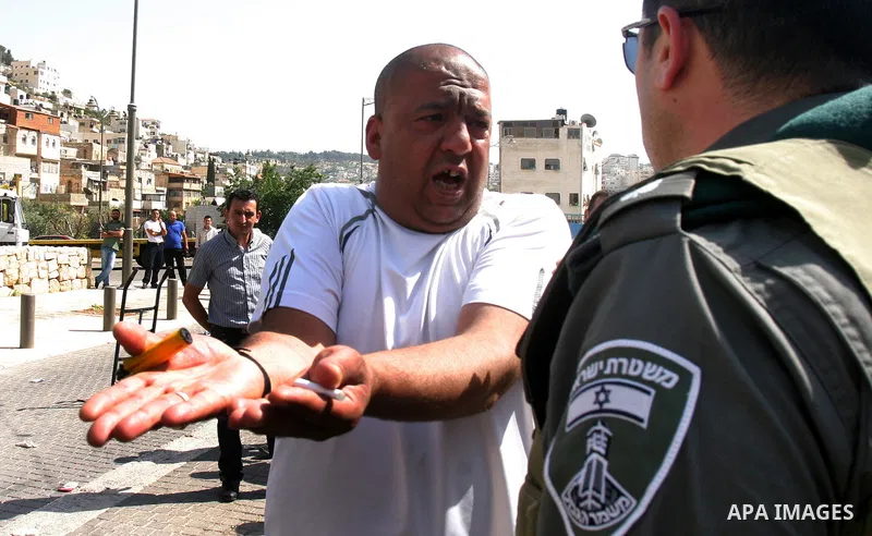 A Palestinian man scuffle with Israeli police, after arresting a Palestinian during clashes between Palestinian youth and the Israeli police in the east Jerusalem neighbourhood of Silwan on May 12, 2012. Israel is to rep...
