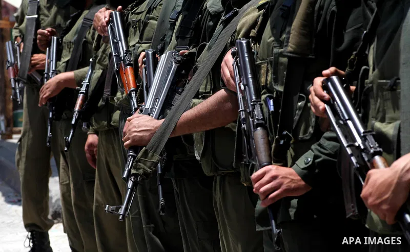 Palestinian police stand in the center of Gaza city during a protest, to show solidarity with Palestinian prisoners held in Israeli jails, May 13, 2012. Hundreds of Palestinians on hunger strike in Israeli jails said on...