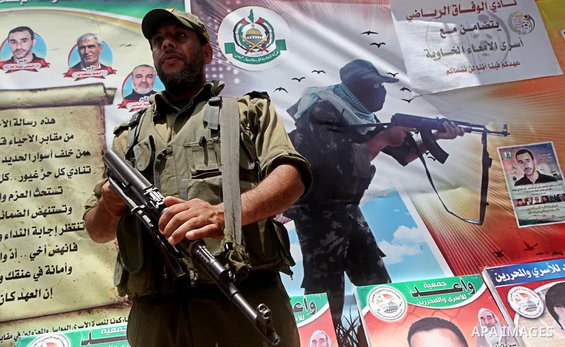 Palestinian police stand in the center of Gaza city during a protest, to show solidarity with Palestinian prisoners held in Israeli jails, May 13, 2012. Hundreds of Palestinians on hunger strike in Israeli jails said on...