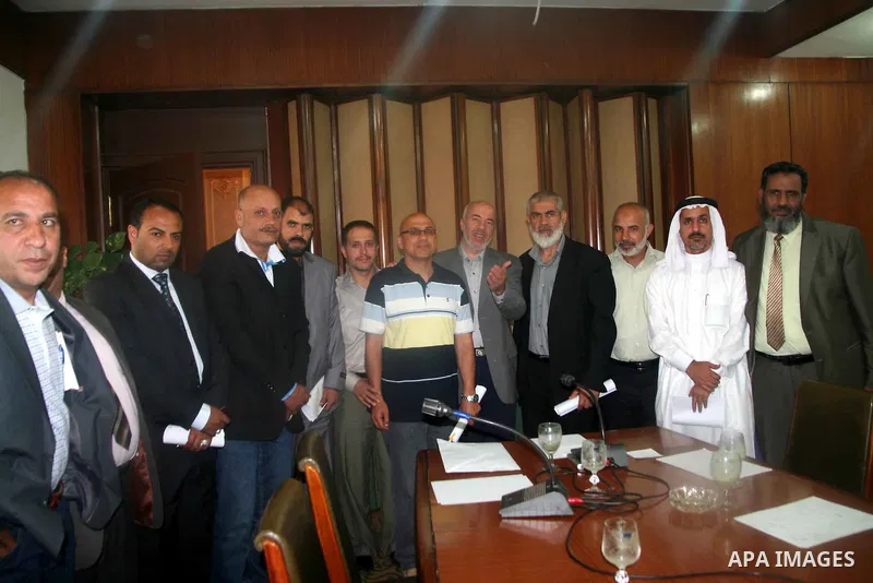 Palestinians delegation of released meets with President Arab Affairs Committee in the Egyptian Parliament, Mohammed Al said Idris, in Cairo on May 14, 2012. Photo by Emad Ashtawy