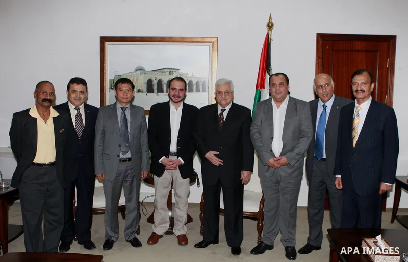 Palestinian President, Mahmoud Abbas (Abu Mazen) meets with heads of football federations participating in the tournament the Nakba, in the West Bank city of Ramallah, on May 14, 2012. Photo by Thaer Ganaim