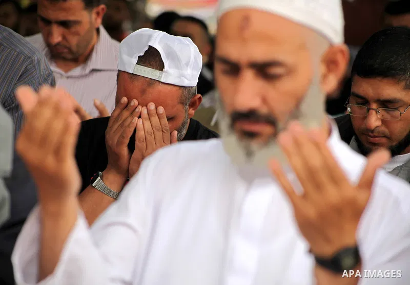 Palestinians take part in mass prayer during rally to show solidarity with prisoners held in Israeli jails, in Gaza City May 14, 2012. One in three of the 4,800 Palestinians serving time in Israeli jails began refusing f...