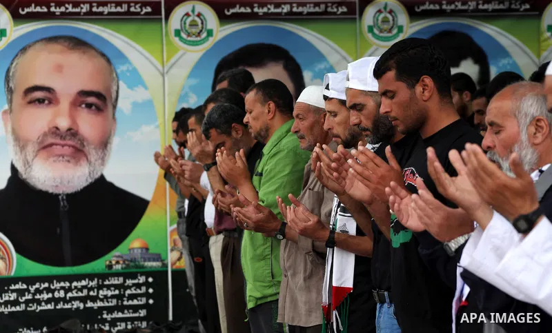 Palestinians take part in mass prayer during rally to show solidarity with prisoners held in Israeli jails, in Gaza City May 14, 2012. One in three of the 4,800 Palestinians serving time in Israeli jails began refusing f...