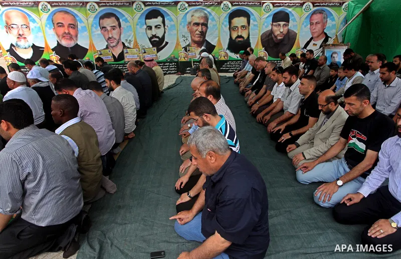 Palestinians take part in mass prayer during rally to show solidarity with prisoners held in Israeli jails, in Gaza City May 14, 2012. One in three of the 4,800 Palestinians serving time in Israeli jails began refusing f...