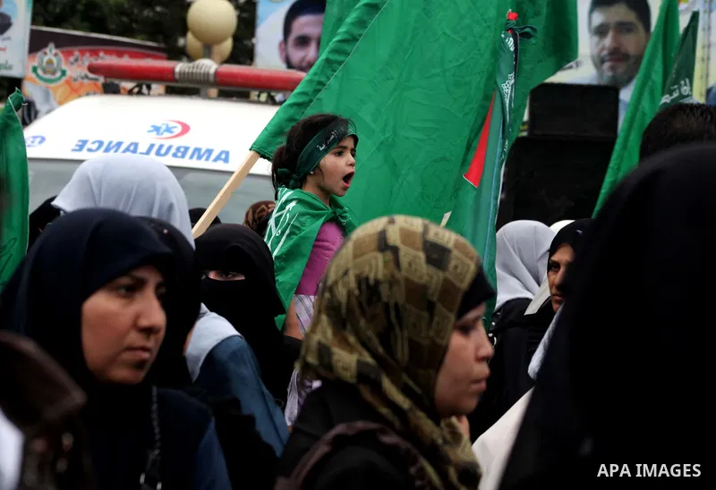 Palestinian women hold pictures of incarcerated relatives in a rally to show solidarity with prisoners held in Israeli jails, in Gaza City May 14, 2012. One in three of the 4,800 Palestinians serving time in Israeli jail...