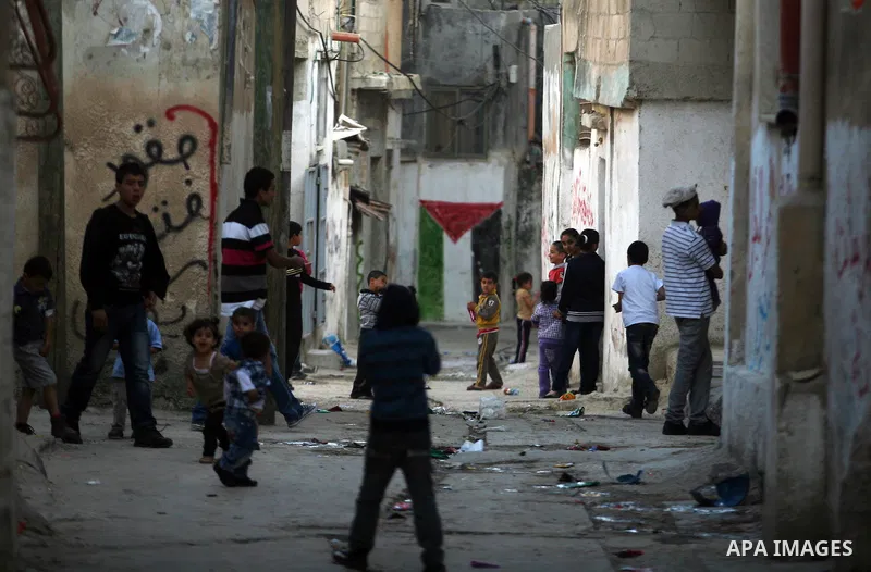 Palestinian refugee children play outside their home, a day before Palestinians mark the 'Nakba' Day (Day of the catastrophe), in the Al amari refugee camp in the West Bank City of Ramallah on 14 May 2012. 'Nakba' Day fo...