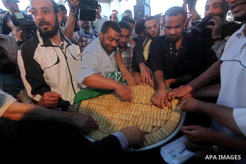 Relatives of Palestinian prisoners held in Israeli jails celebrate after the signing of a deal to end the prisoners hunger strike in Gaza City on 14 May 2012. Israel and Palestinian signed an agreement 14 May ending a ma...