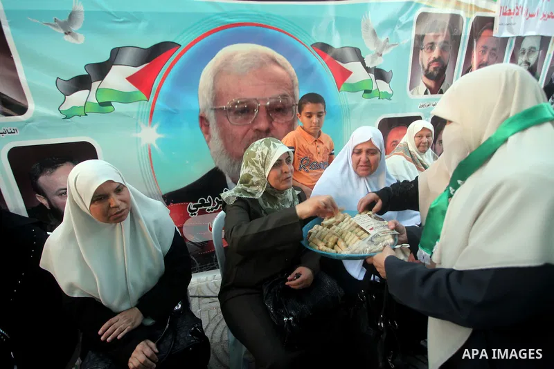 Relatives of Palestinian prisoners held in Israeli jails celebrate after the signing of a deal to end the prisoners hunger strike in Gaza City on 14 May 2012. Israel and Palestinian signed an agreement 14 May ending a ma...