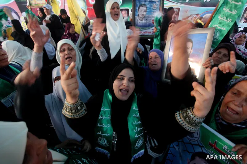 Relatives of Palestinian prisoners held in Israeli jails celebrate after the signing of a deal to end the prisoners hunger strike in Gaza City on 14 May 2012. Israel and Palestinian signed an agreement 14 May ending a ma...