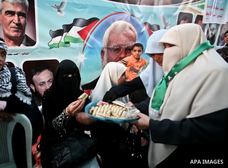 Relatives of Palestinian prisoners held in Israeli jails celebrate after the signing of a deal to end the prisoners hunger strike in Gaza City on 14 May 2012. Israel and Palestinian signed an agreement 14 May ending a ma...